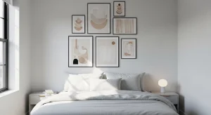  small apartment bedroom with vertical gallery wall above the bed